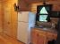 Picture of the kitchen area with half bath inside a deluxe cabin