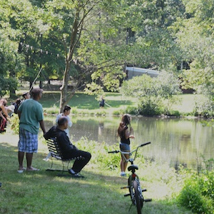 Kymer's guests relaxing by the pond