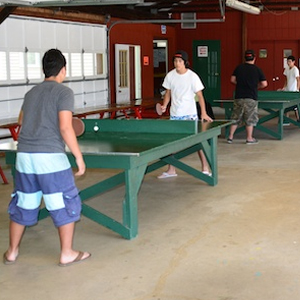 Two guys playing ping pong at Kymer's